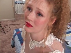 KiloPanties presents: Redhead in wedding dress models her pussy