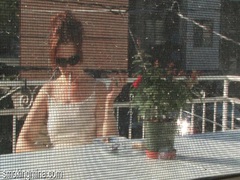 KiloPanties presents: Cute chick smokes on the porch as he films it