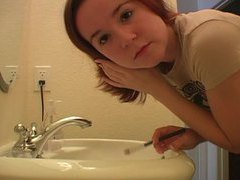 KiloPanties presents: Redhead in tee shirt does her makeup