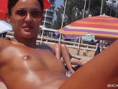 KiloPanties presents: Small tits girl with a great tan is topless at the beach