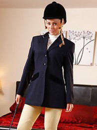 KiloPanties presents: Clare R seductifvely removes her riding gear leaving on only opaque hold ups and sheer underwear